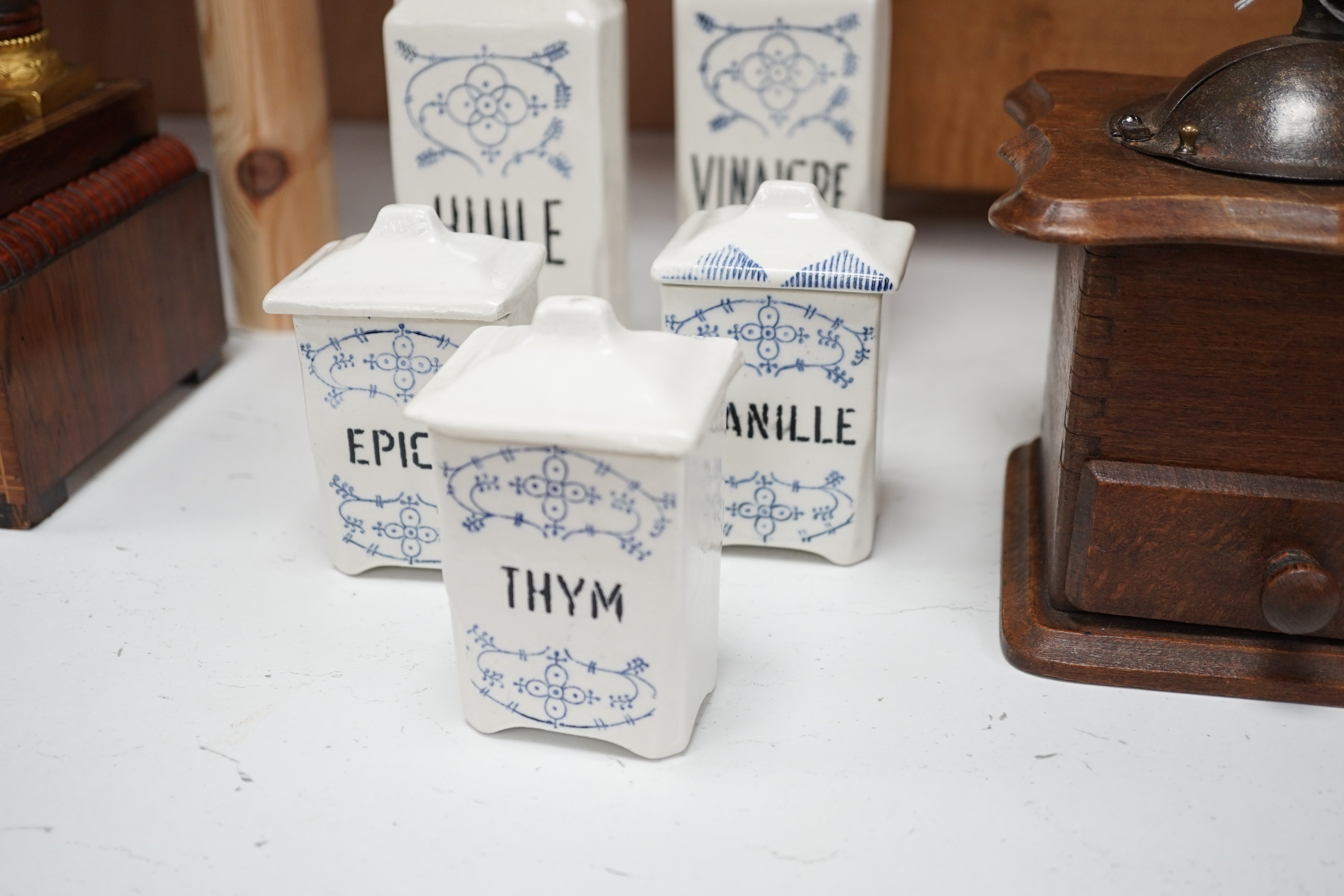 Kitchenalia: A group of French ceramic storage jars and metal canisters, a Danish bread slicer, a French coffee grinder and a croc and cover, bread slicer 31cms wide